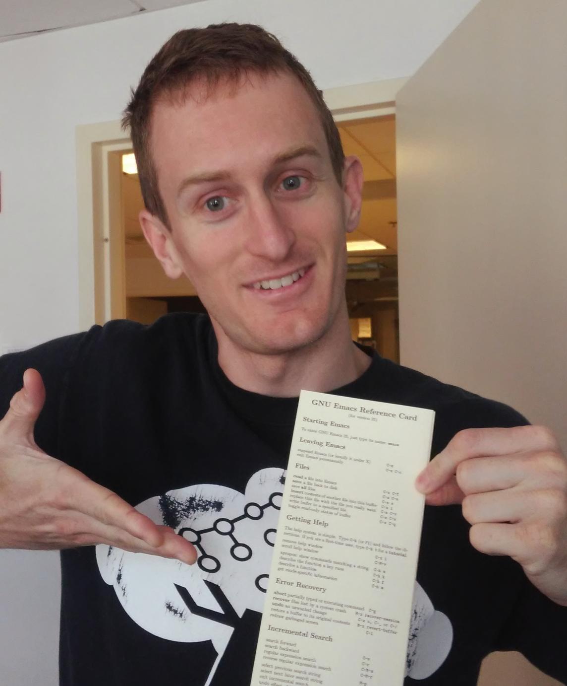 Ian Kelling pointing at a reference card