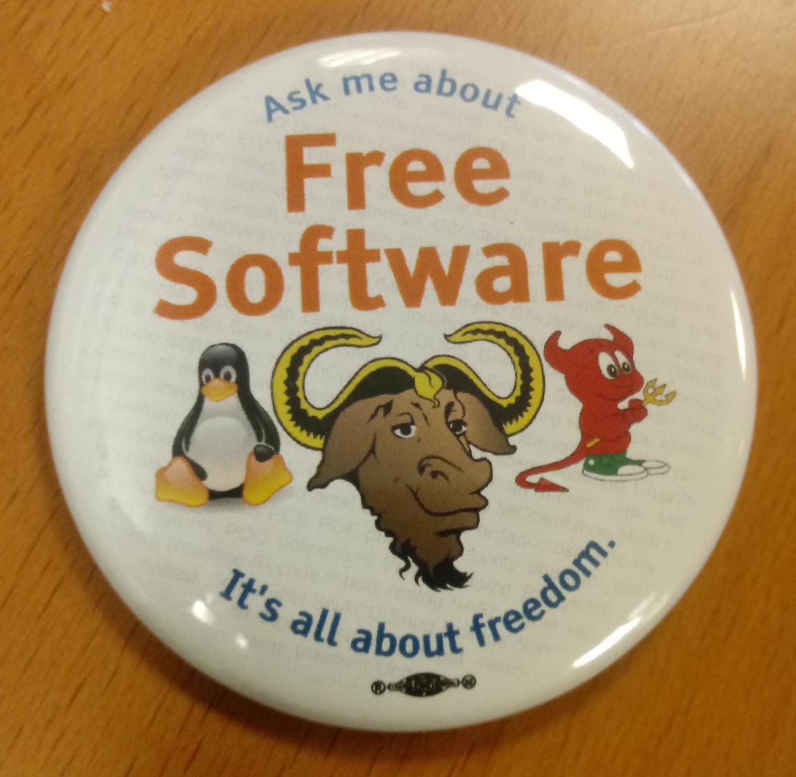 A pin with the text "Ask me about Free software. It's all about freedom".