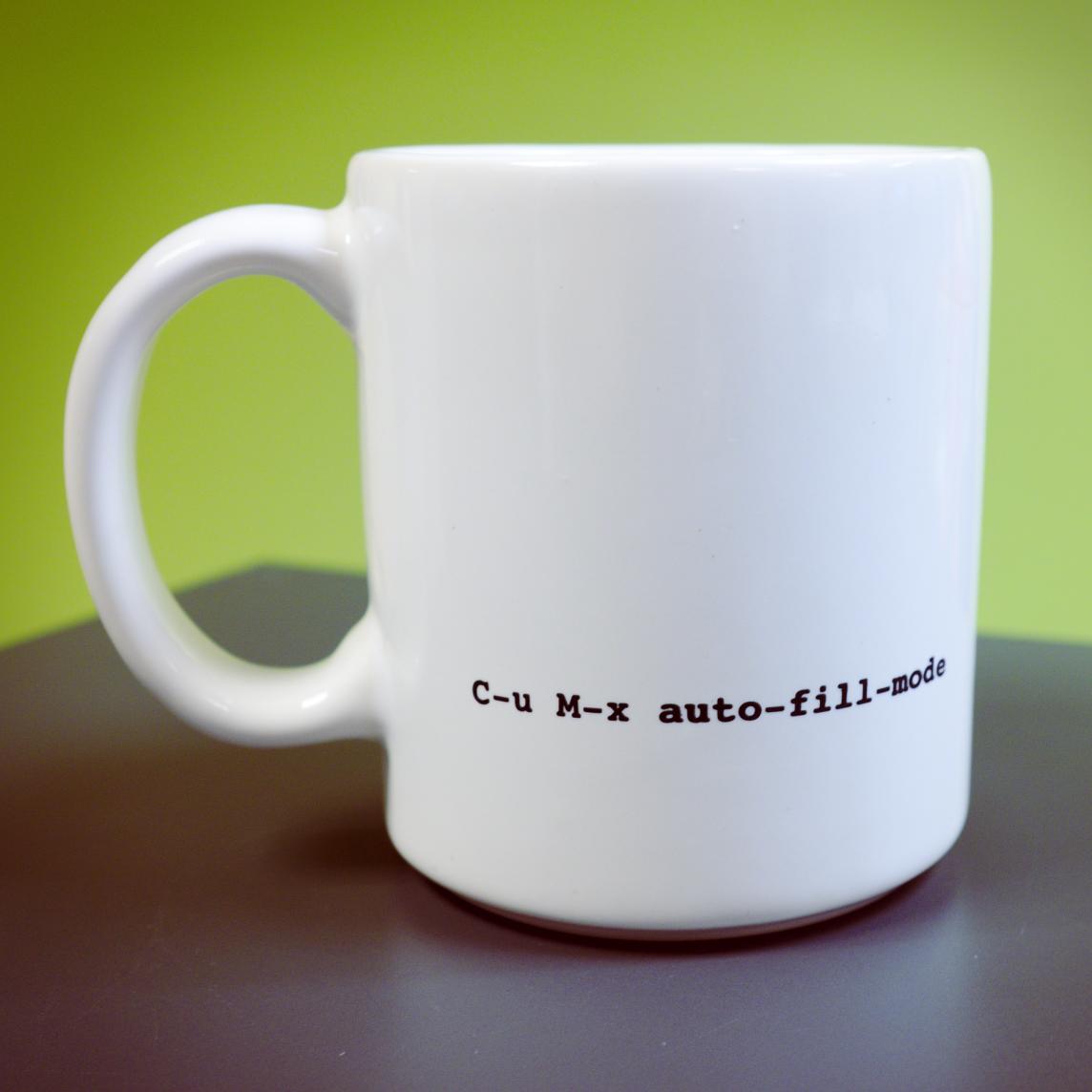 The back view of the mug, with clever text saying "C-u M-x auto-fill-mode"