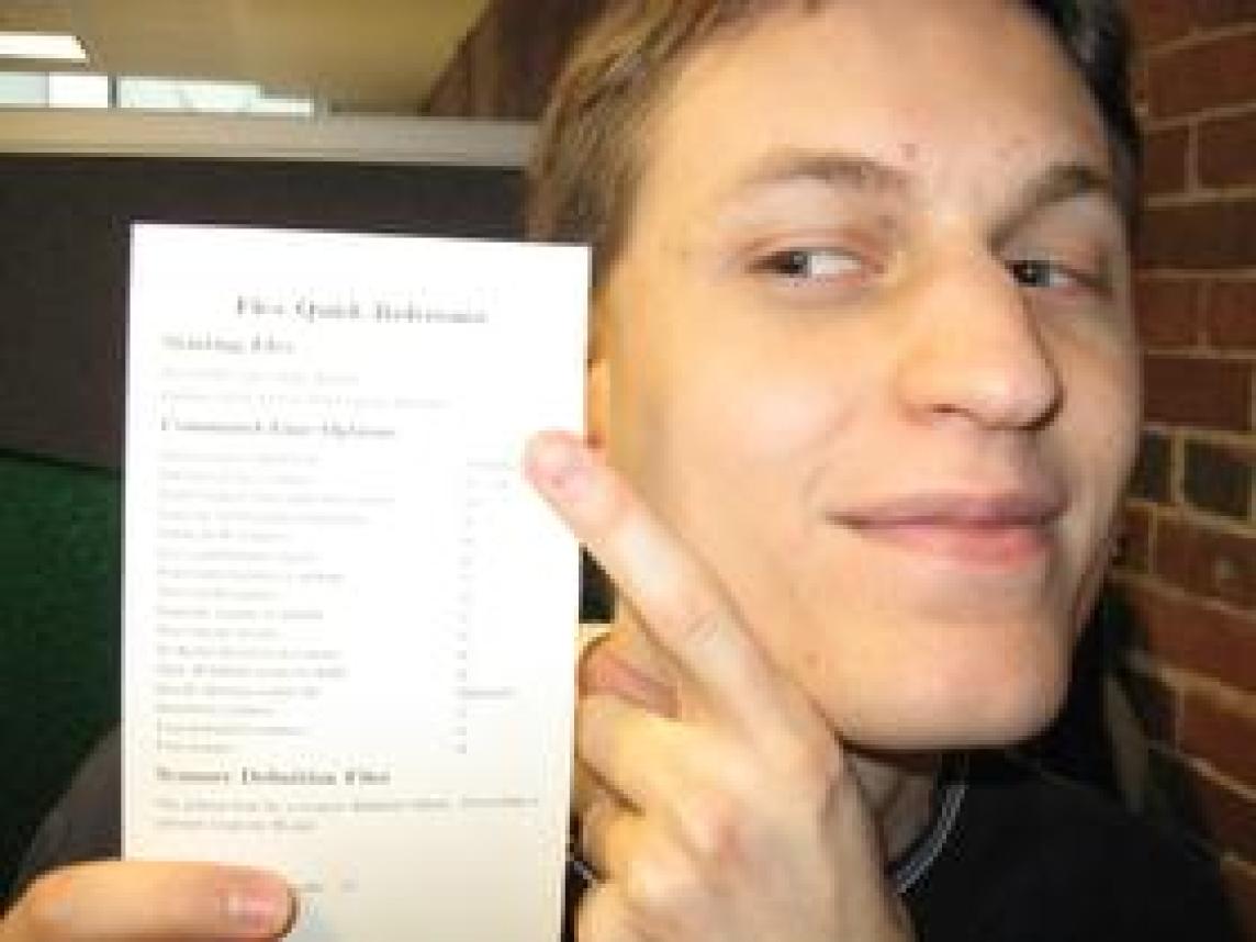 Brett pointing at a reference card