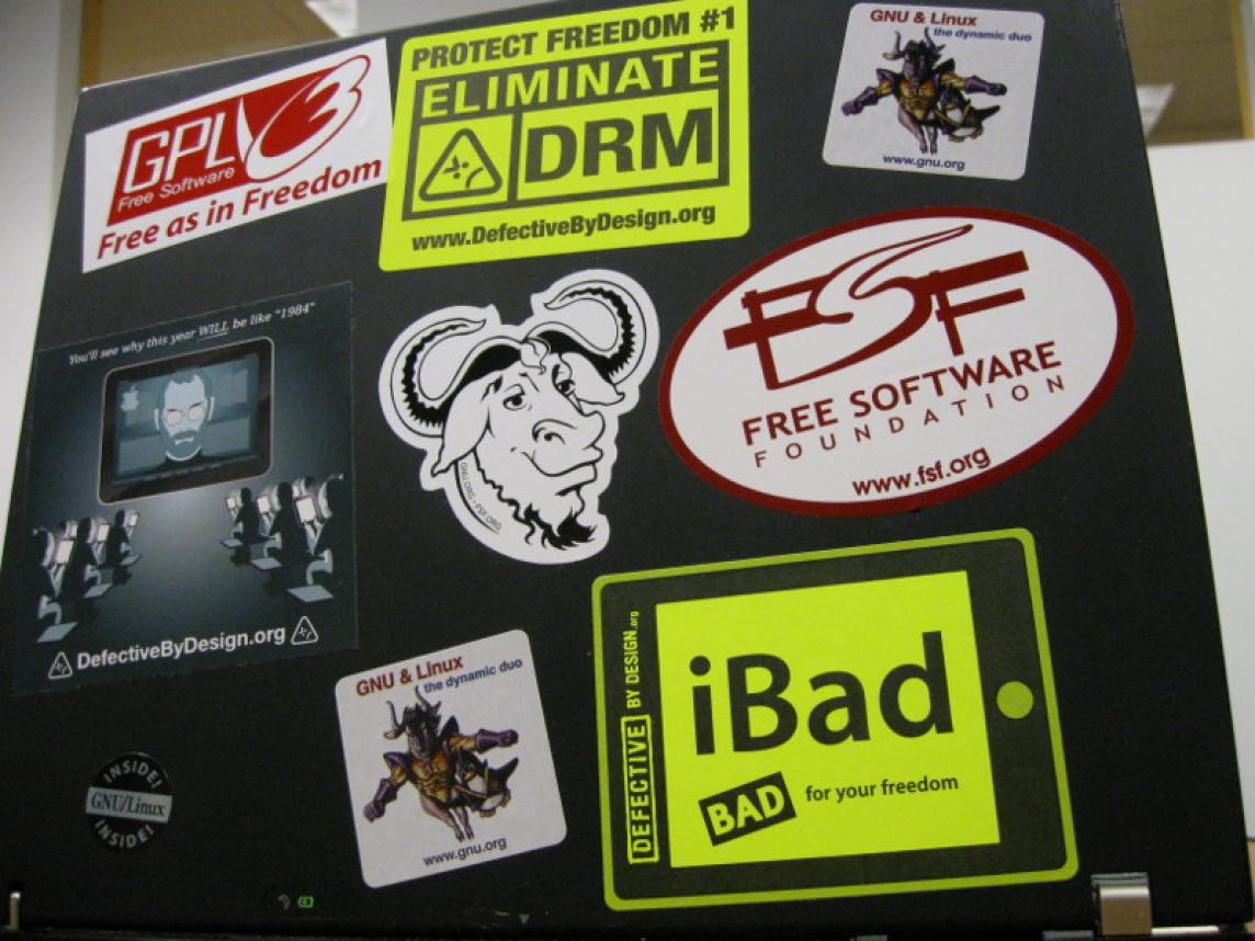 A laptop covered with stickers