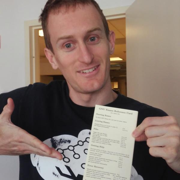 Ian Kelling pointing at a reference card