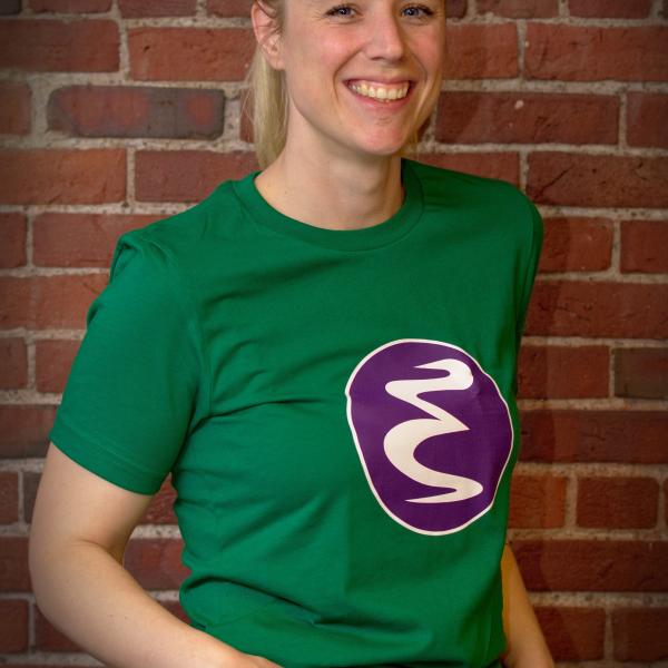 Zoë wearing a green and purple Emacs logo t-shirt