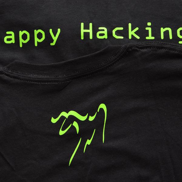 A black t-shirt with a green terminal font saying "Happy Hacking", and a green Emacs gnu logo