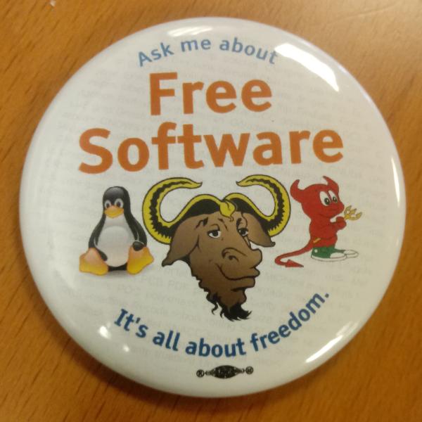 A pin with the text "Ask me about Free software. It's all about freedom".