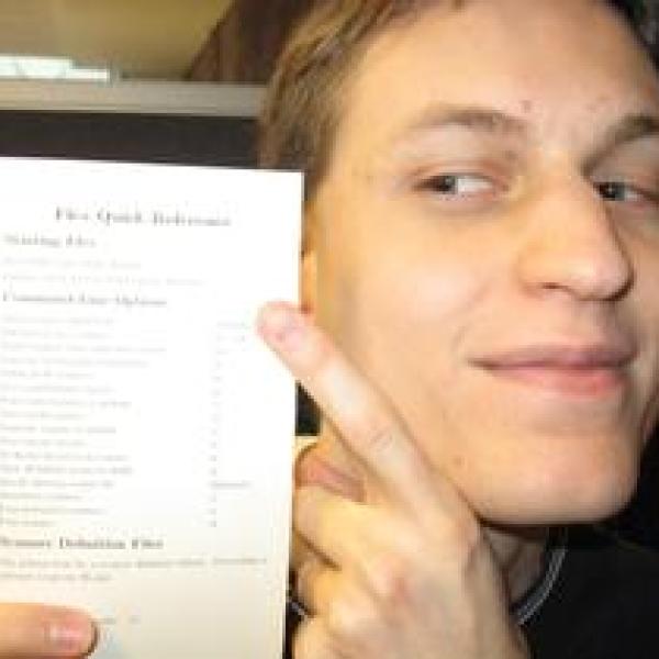 Brett pointing at a reference card