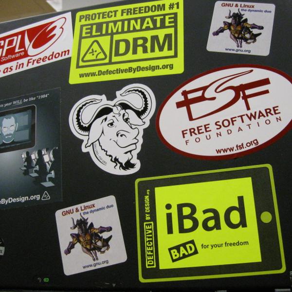 A laptop covered with stickers