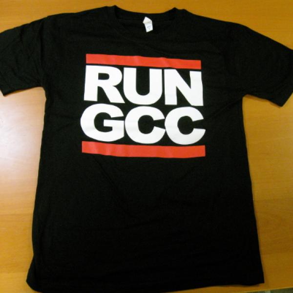 A black t-shirt with white text saying RUN GCC